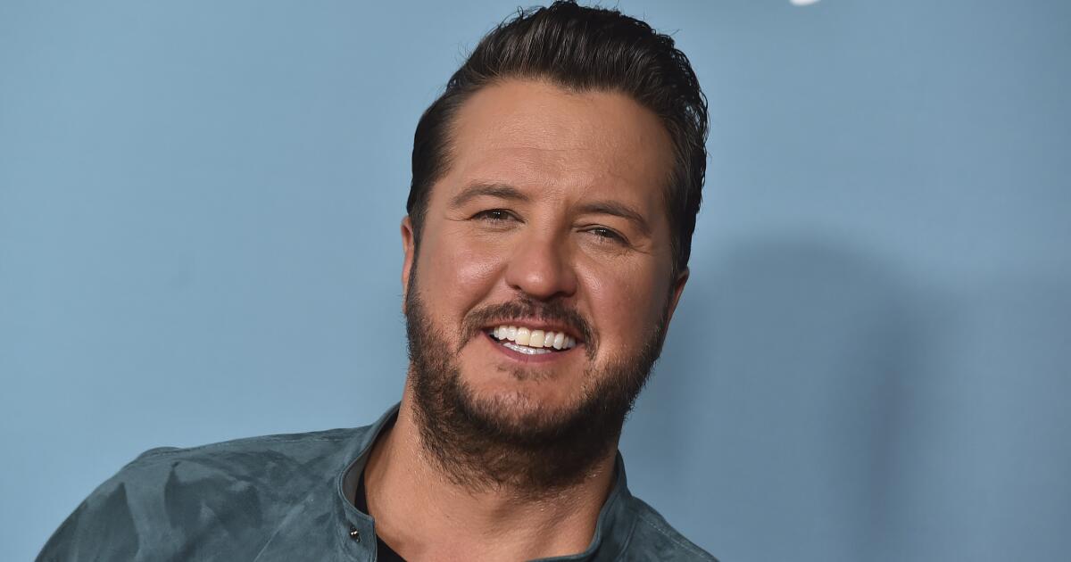 Luke Bryan failed to slip on a cellphone onstage: ‘I was type of hamming that up’