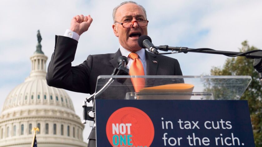 Senate Minority Leader Charles E. Schumer (D-N.Y.) speaks at a rally against the GOP tax plan in Washington on Nov. 15.
