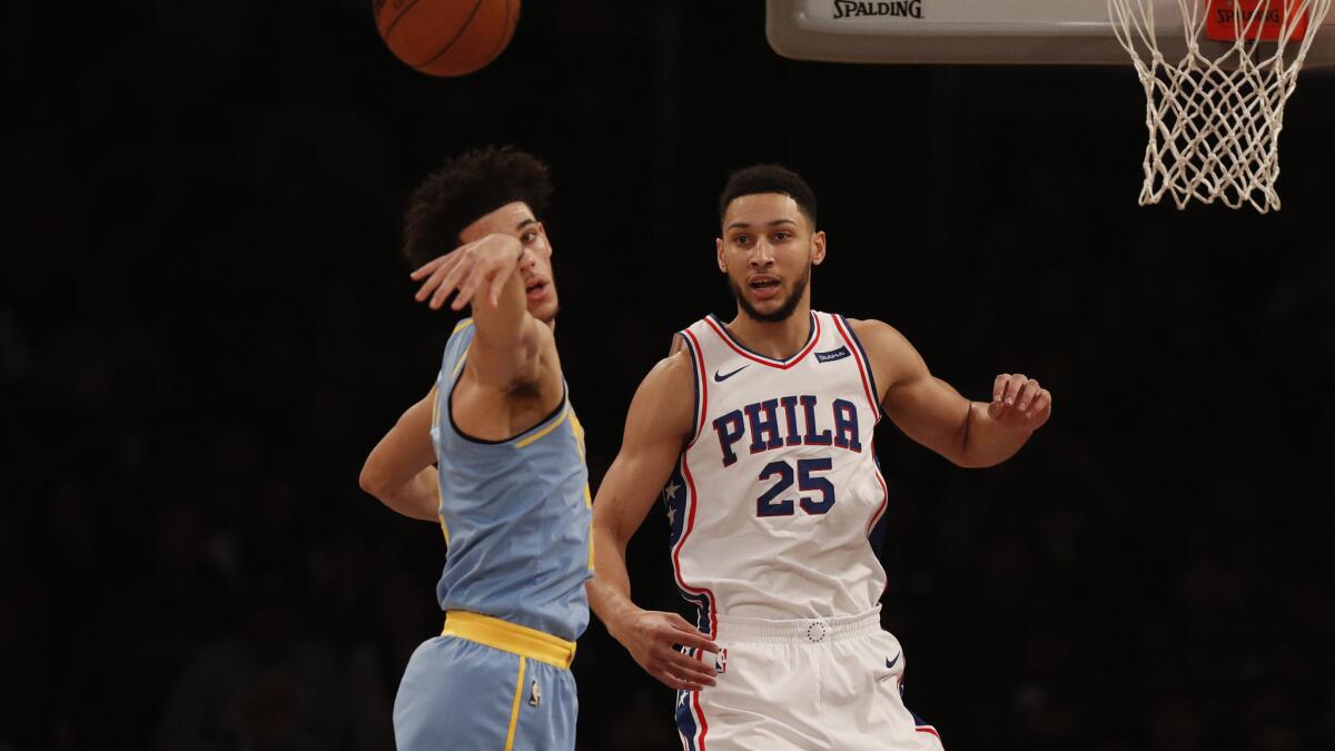 Then-Lakers guard passes to a teammate after having a drive cut off by 76ers forward Ben Simmons.