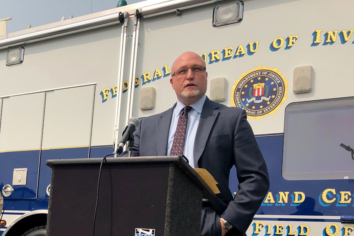 The FBI's Jack Bennett announces federal charges against 25 defendants