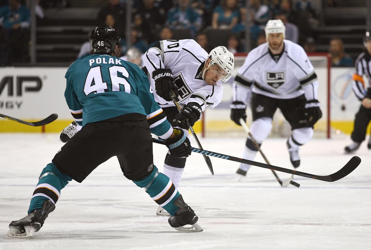 Kings forward Tanner Pearson (70) passes the puck up ice past Sharks defenseman Roman Polak (46) in the first period of Game 3.