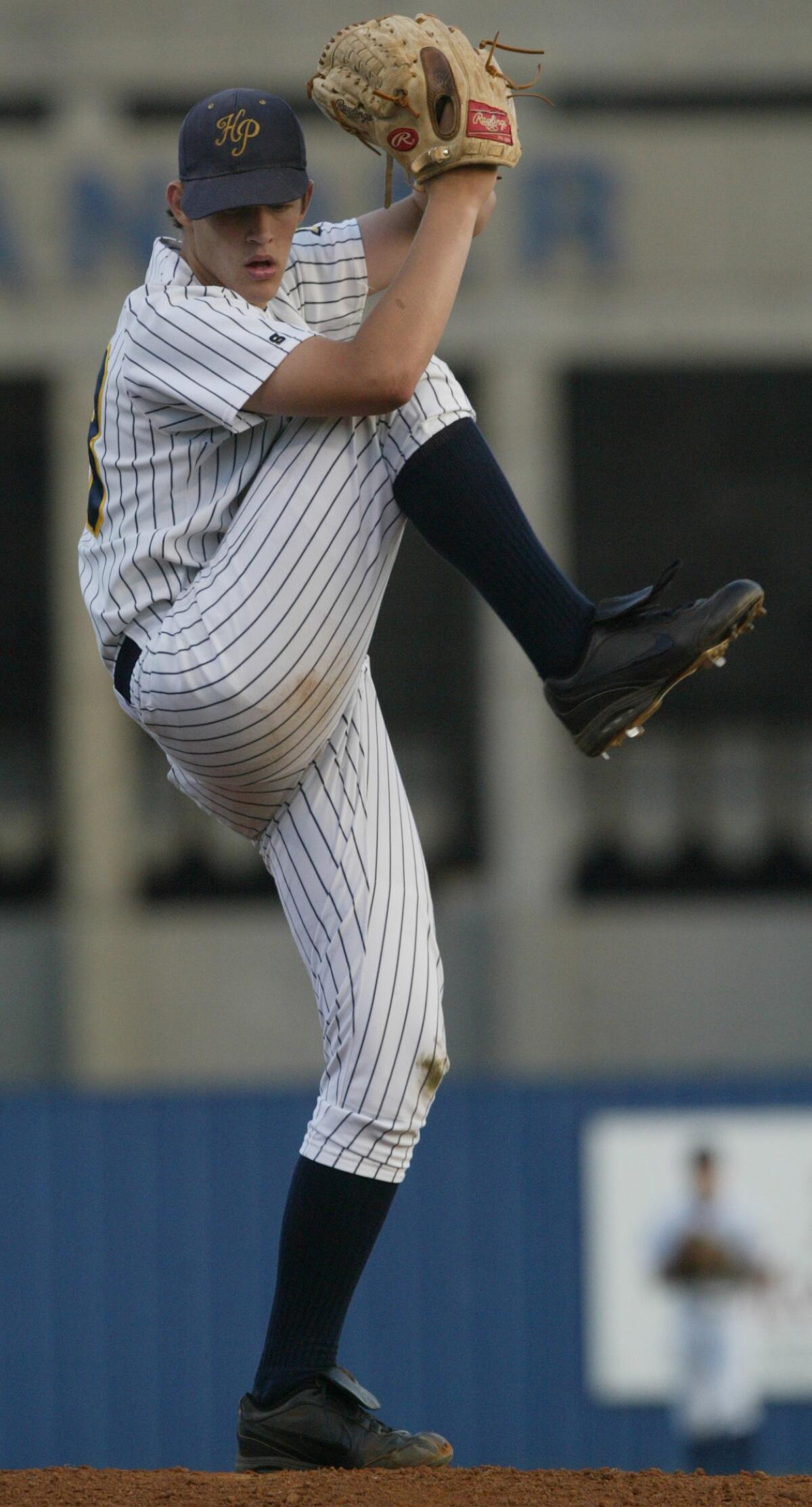 Highland Park's starting pitcher Clayton Kershaw winds up to throw against Arlington Martin  in 2005.