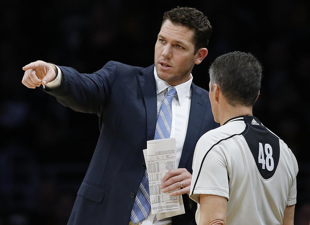 Lakers Coach Luke Walton talks with referee Scott Foster (48) during the first half on Nov. 20.