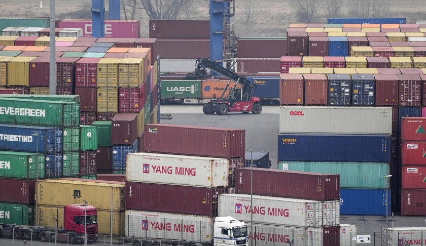 Containers are handled at a logistic port in Duisburg, Germany, Tuesday, Jan. 25, 2022. Europe's biggest economy, has picked up unexpectedly after a six-month slide, a closely watched survey showed Tuesday. (AP Photo/Martin Meissner)