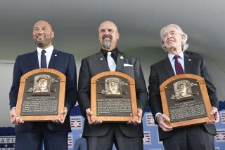Hall of Fame inductees, from left, Derek Jeter, Larry Walker and Ted Simmons hold their plaques for photos after the induction ceremony at Clark Sports Center on Wednesday, Sept. 8, 2021, at the National Baseball Hall of Fame in Cooperstown, N.Y. (AP Photo/Hans Pennink)