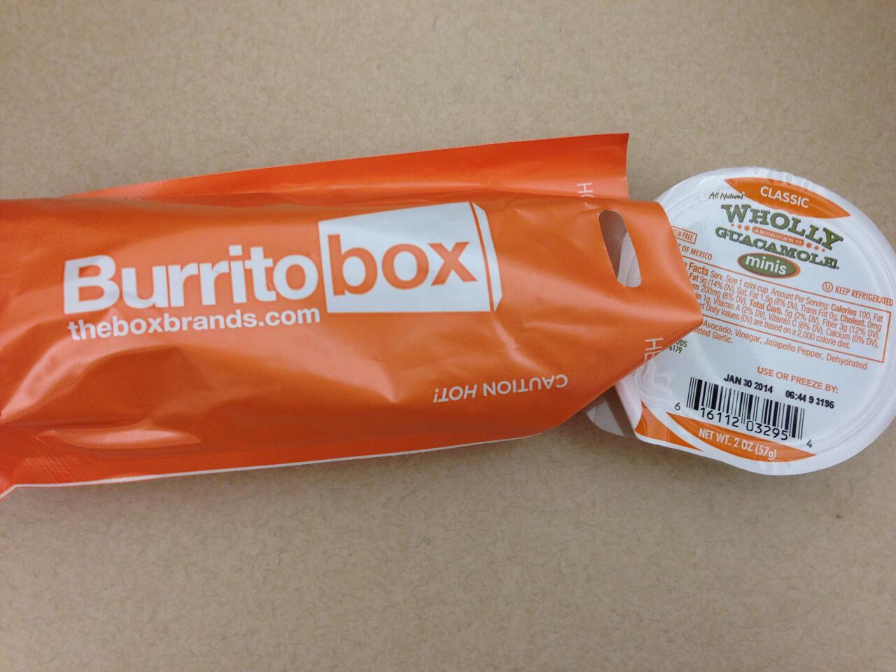 The $3 burritos come wrapped in paper inside orange bags. A side of guacamole costs extra.