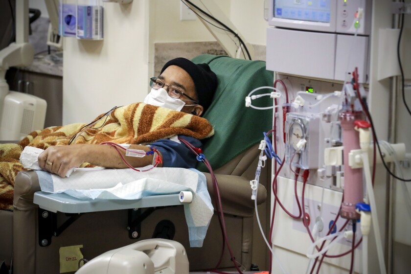 A COVID-19 patient gets dialysis treatment