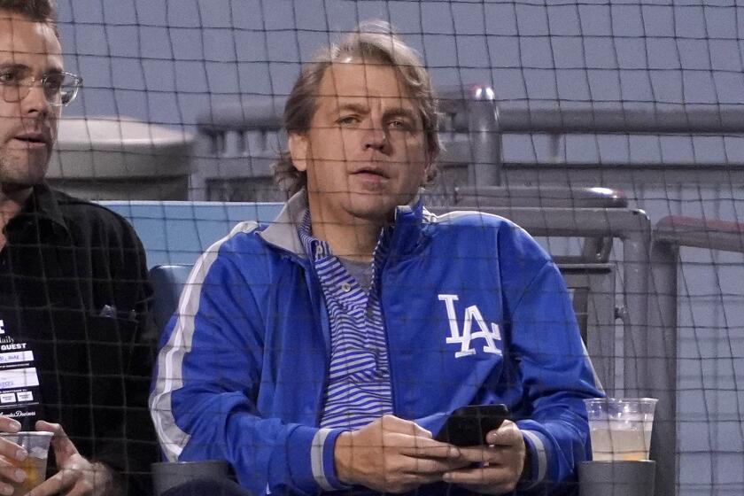 Los Angeles Dodgers co-owner Todd Boehly, right, is seen during a baseball game.
