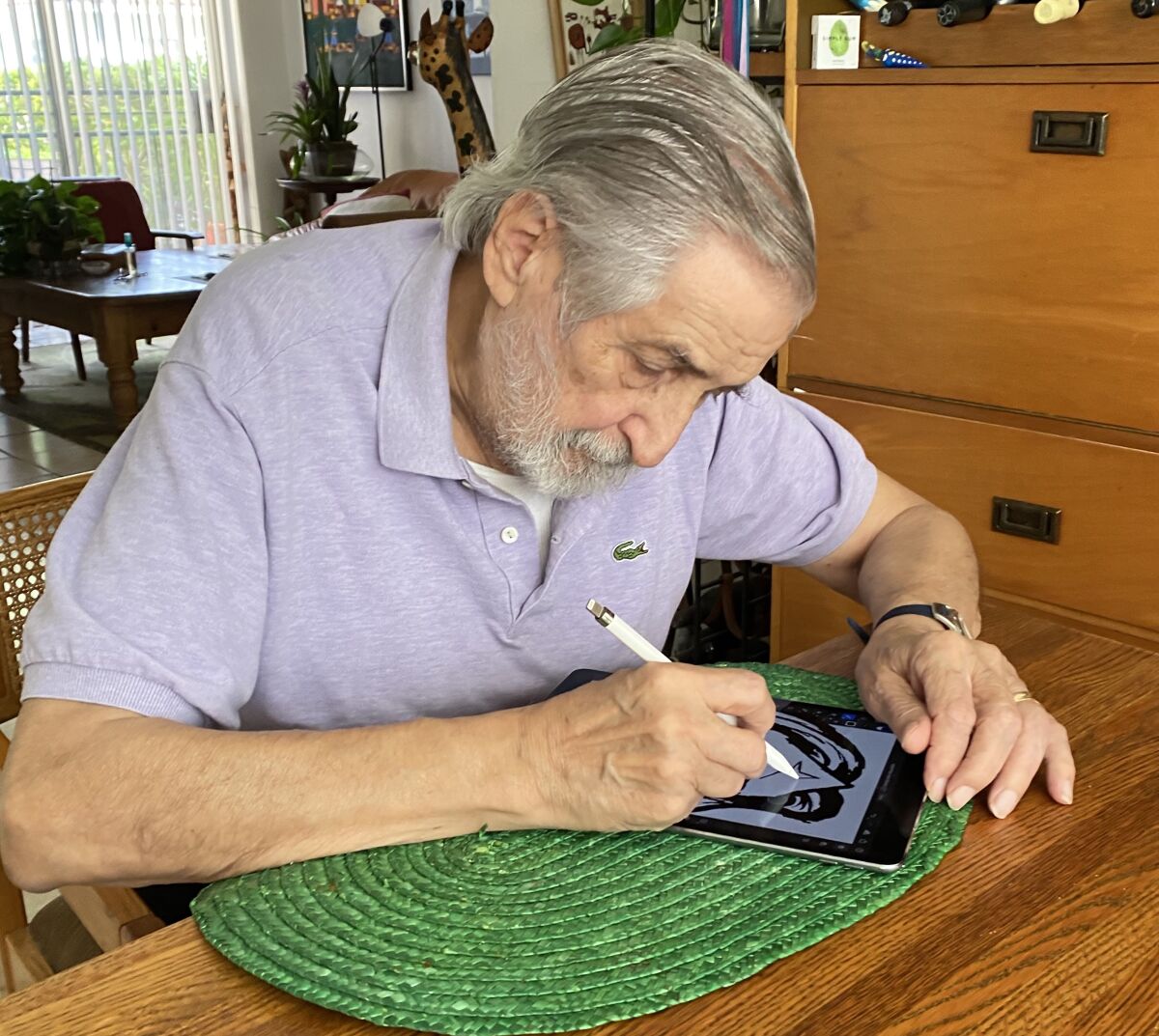 Jose Delbo, an 87-year-old comic book artist, draws on an iPad using a stylus.