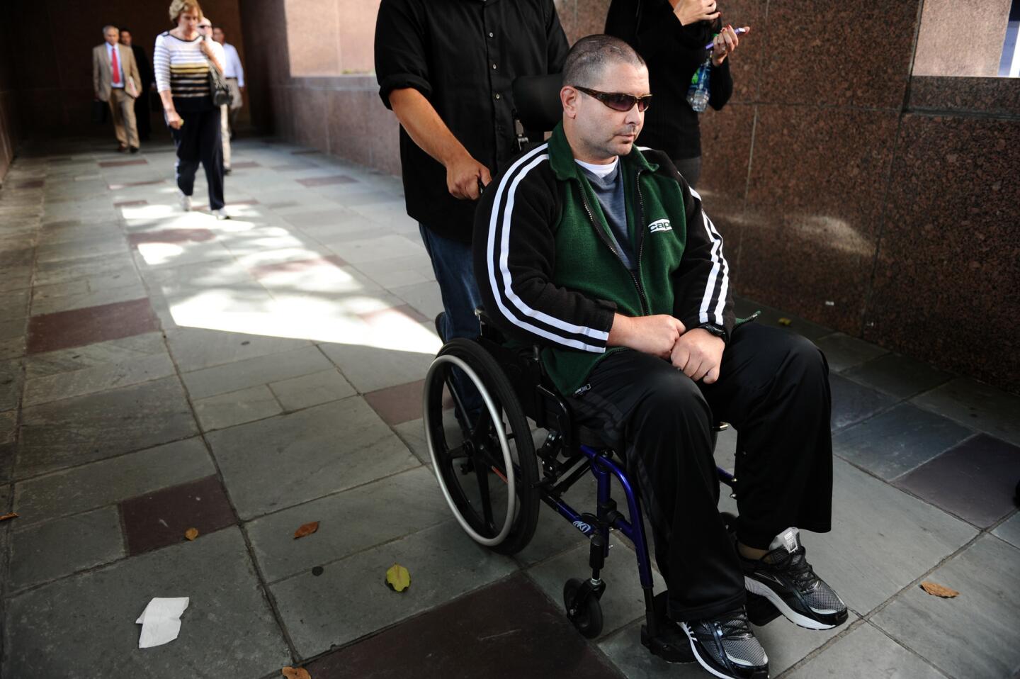 Bryan Stow is wheeled out of the courthouse in downtown Los Angeles on June 25. An L.A. jury on July 9 ruled that the Dodgers were partly liable for injuries Stow suffered in a March 31, 2011, beating at Dodger Stadium.