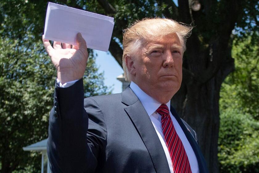US President Donald Trump holds piece of paper saying its his deal with Mexico as he speaks with reporters at the White House, in Washington, DC, on June 11, 2019. - Trump did not show the paper to reporters. (Photo by Jim WATSON / AFP)JIM WATSON/AFP/Getty Images ** OUTS - ELSENT, FPG, CM - OUTS * NM, PH, VA if sourced by CT, LA or MoD **