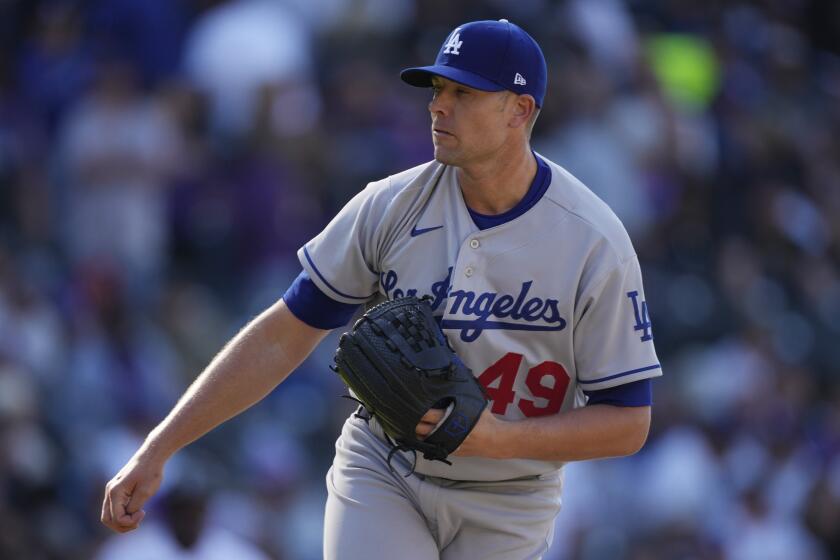 Los Angeles Dodgers relief pitcher Blake Treinen (49) in the seventh inning of a baseball game.