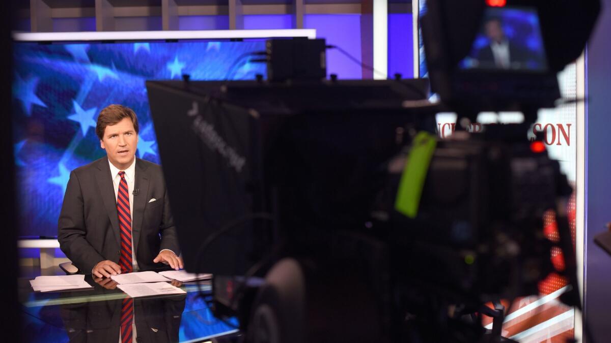 Fox News' Tucker Carlson in his studio