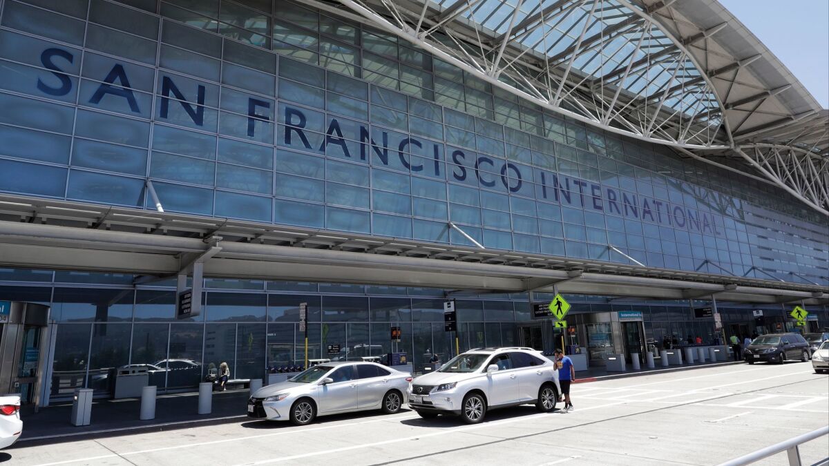 Vehicles wait outside San Francisco International Airport in 2017.