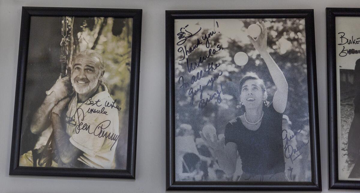 Framed celebrity photos including Sean Connery at Ursula's Costumes