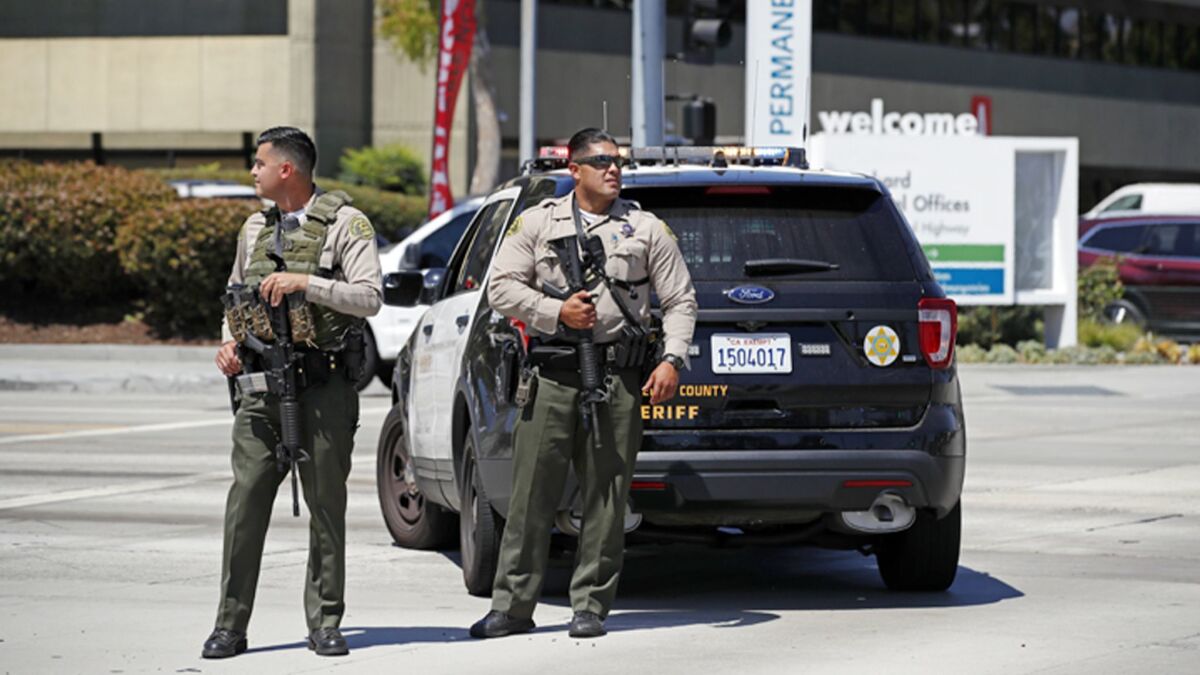 Voters in 2020 will decide whether to give greater authority to the civilian panel overseeing the Los Angeles County Sheriff's Department, the Board of Supervisors decided Tuesday. Above, deputies at a hospital lockdown in Downey last month.