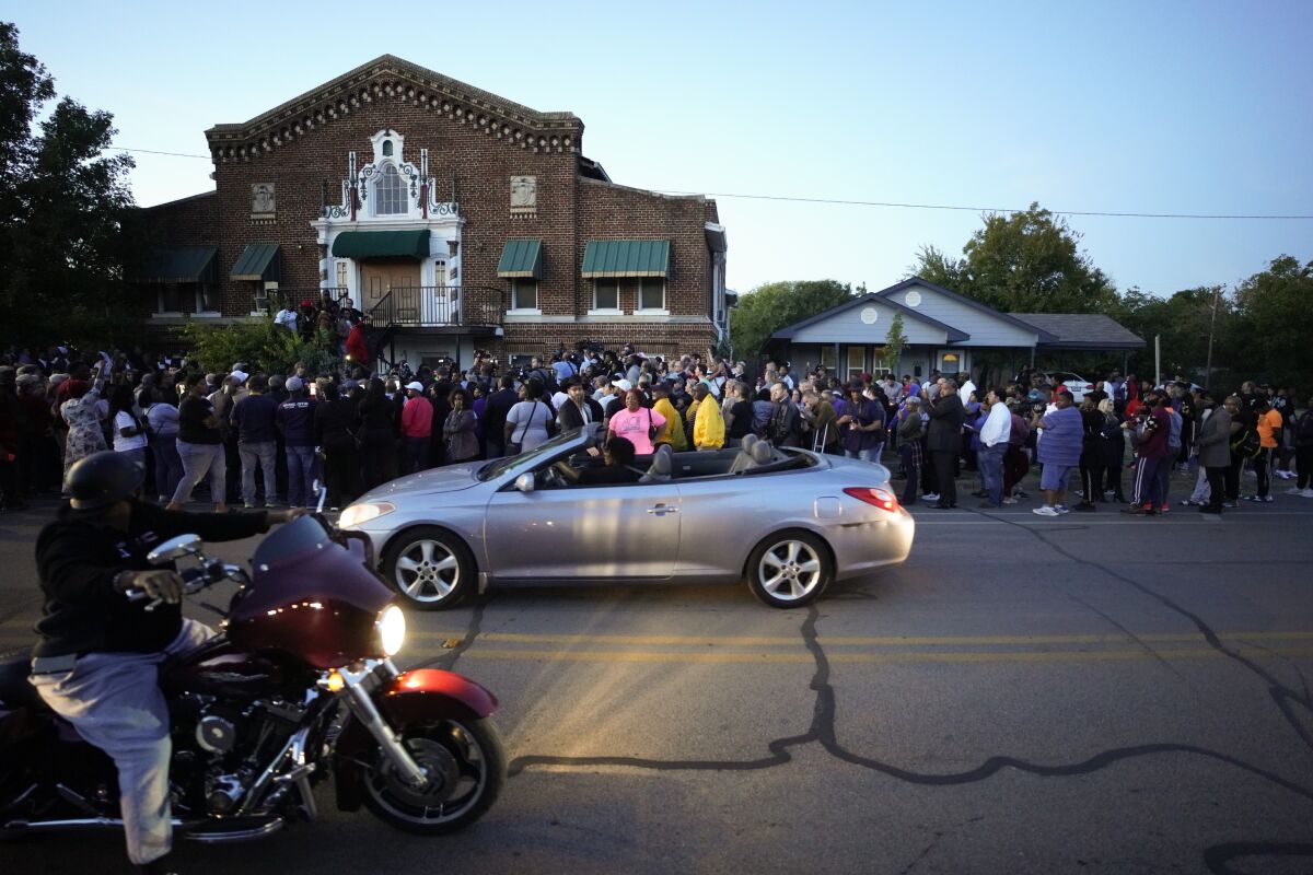 Protesters gather outside the Fort Worth house where Atatiana Jefferson was shot and killed.