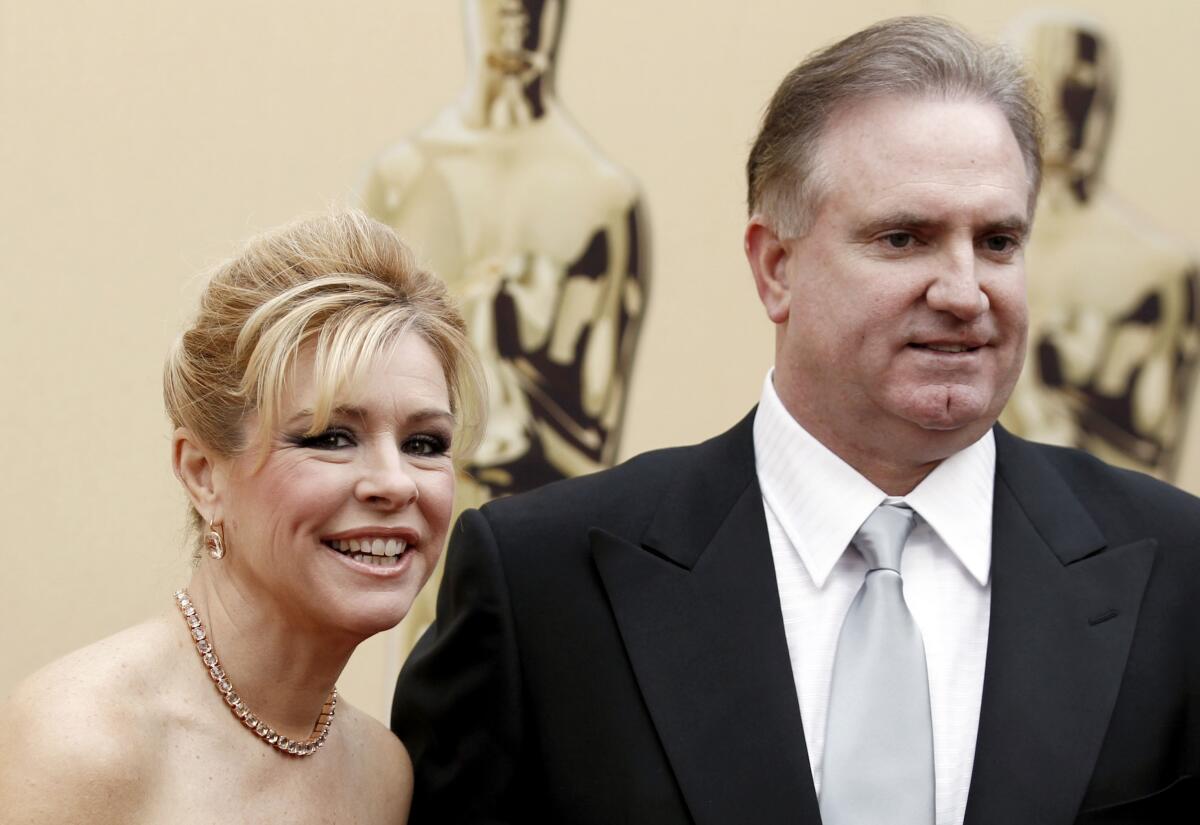 Leighe Ann Tuohy and Sean Tuohy arrive at the 82nd Academy Awards