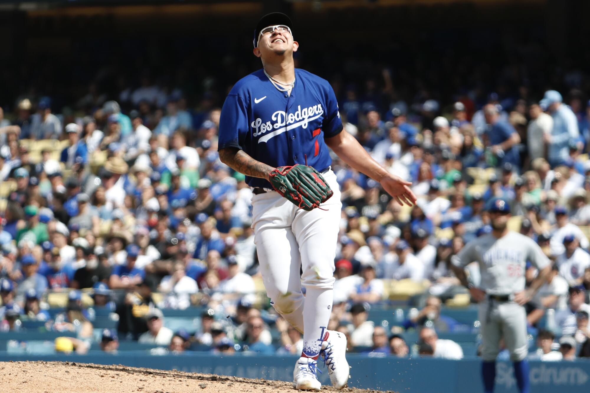 Dodgers' Julio Urias looks up in agony after allowing a home run to Chicago Cubs' Patrick Wisdom during the sixth inning