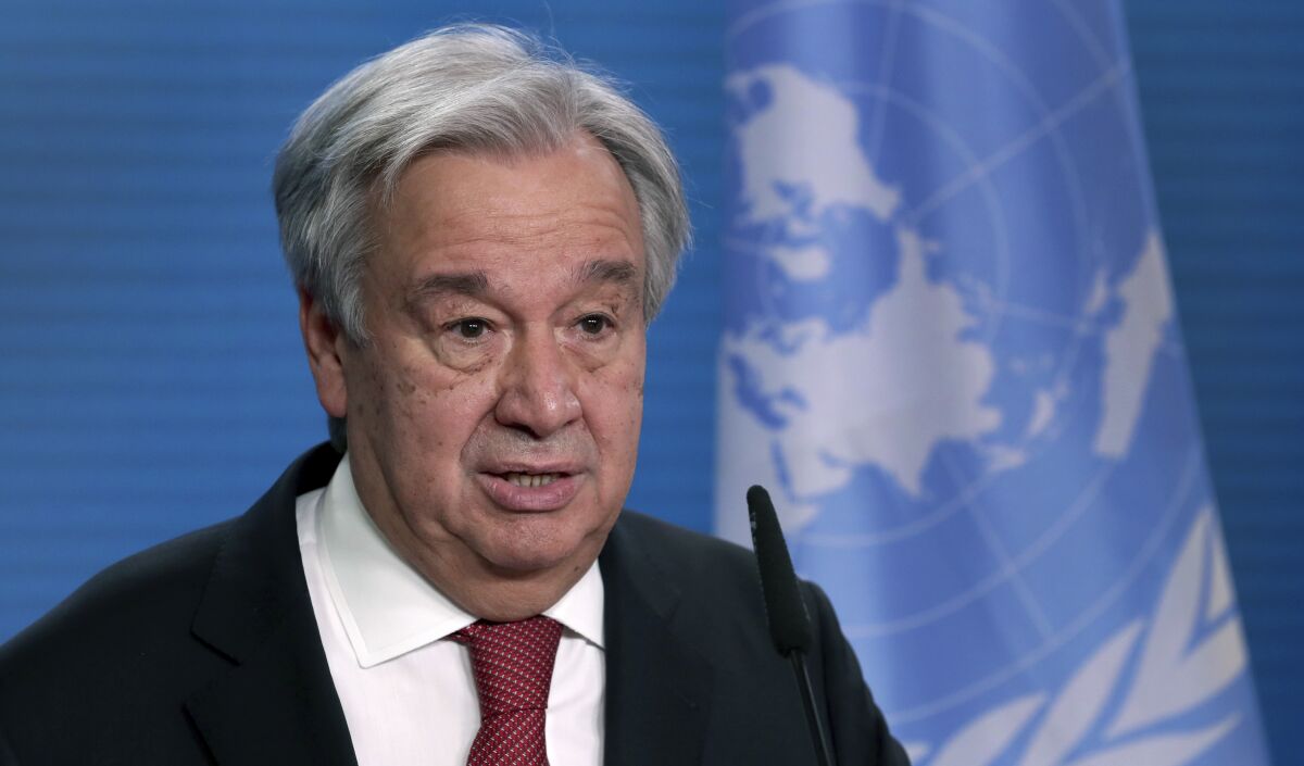 FILE - In this Dec. 17, 2020 file photo, UN Secretary-General Antonio Guterres addresses the media during a joint press conference in Berlin, Germany. The head of the United Nations is calling for “immediate, rapid and large-scale” cuts in greenhouse gas emissions to curb global warming. Antonio Guterres warned governments ahead of next week's annual U.N. General Assembly that climate change is proceeding faster than predicted and fossil fuel emissions have already bounced back from a pandemic dip. Speaking at the launch of a U.N.-backed report summarizing current efforts to tackle climate change, Guterres said recent extreme weather showed no country is safe from climate-related disasters. (AP Photo/Michael Sohn, pool, File)