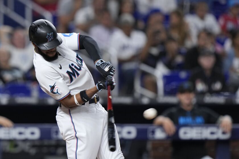 Miami Marlins' Bryan De La Cruz hits a double scoring Jean Segura, Nick Fortes and Luis Arraez during the fifth inning of a baseball game against the Kansas City Royals, Tuesday, June 6, 2023, in Miami. De La Cruz advanced to third on a throwing error by Matt Duffy. (AP Photo/Wilfredo Lee)