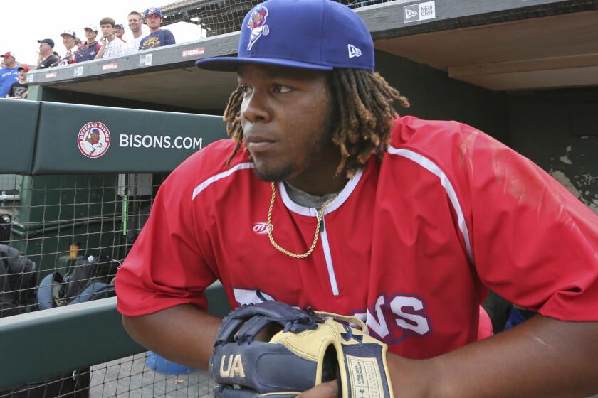 Vladimir Guerrero Jr. watches from the Buffalo Bisons during a minor league game last season.