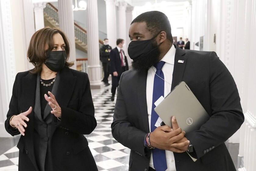 Vice President Kamala Harris with her aide, Vince Evans inside the Eisenhower Executive Office Building in the White House complex. Evans announced last month that that he was leaving the Biden administration.