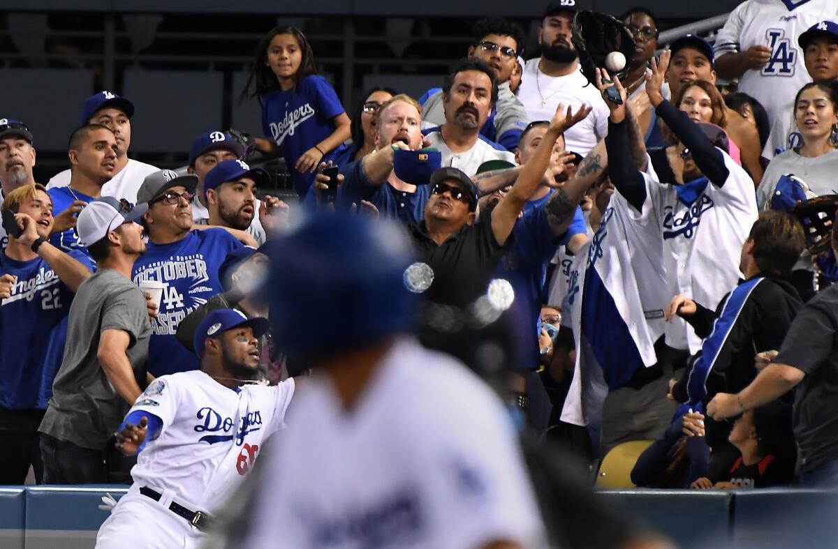 Dodgers right fielder Yasiel Puig can't make the catch on a two-run home run by Brewers shortstop Orlando Arcia in the seventh inning.