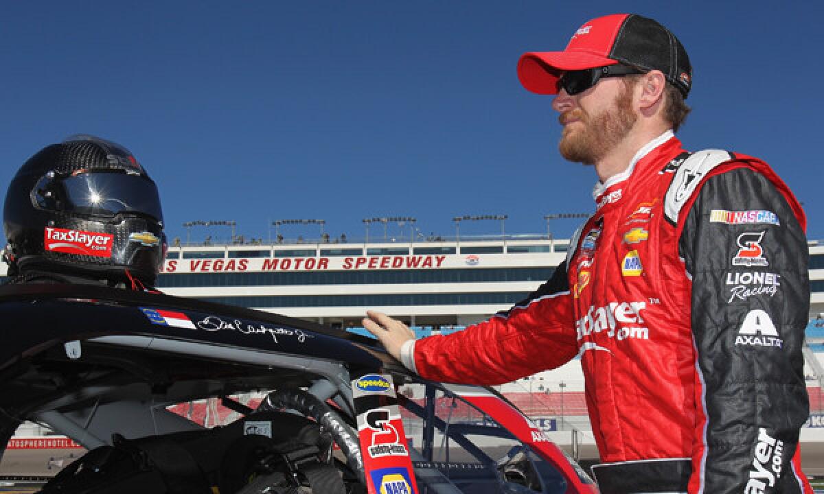 Dale Earnhardt Jr. stands on the grid prior to qualifying Saturday for last Sunday's NASCAR Sprint Cup Series race at Las Vegas Motor Speedway.
