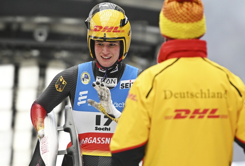 Natalie Geisenberger of Germany waves after the women's competition at the Luge World Cup in Sochi, Russia, Sunday, Dec. 5, 2021. (AP Photo/Ekaterina Lyzlova)