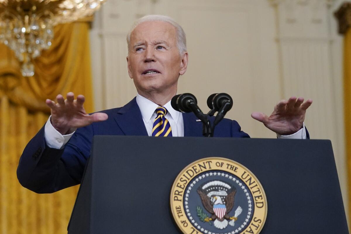 President Biden speaks during a news conference at the White House on Jan. 19. 