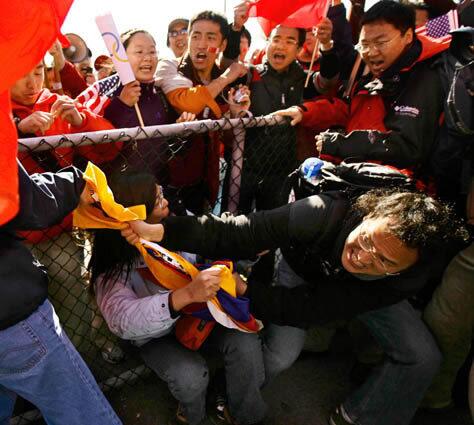 Supporters of Tibetan independence tussle with China backers as the relay in San Francisco begins. Several torchbearers dropped out and every San Francisco law enforcement officer was on duty in a chaotic day that saw several scuffles and a small number of arrests.