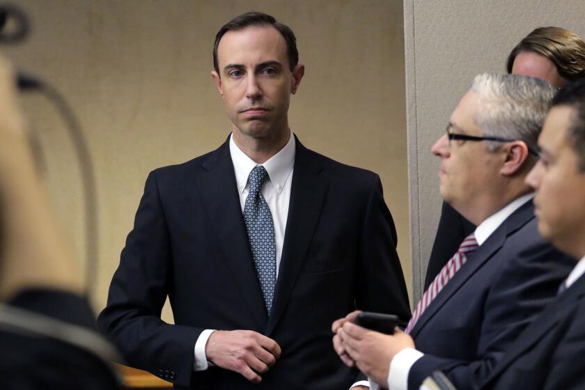 FILE - In this Feb. 7, 2019 file photo, Secretary of State David Whitley, left, arrives for his confirmation hearing in Austin, Texas. Texas has settled a federal lawsuit over the state's bungled search for non-citizens among the state's 16 million registered voters. The agreement announced Friday, April 26, 2019 ends an effort by Texas elections officials that led to the state wrongly questioning the U.S. citizenship of tens of thousands of voters. Whitley said the agreement allows the state to continue "voter registration list maintenance" but ensures that the same mistakes won't happen again. (AP Photo/Eric Gay, File)