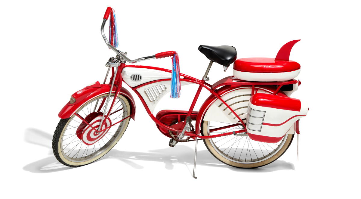 Red Schwinn DX bicycle replica.