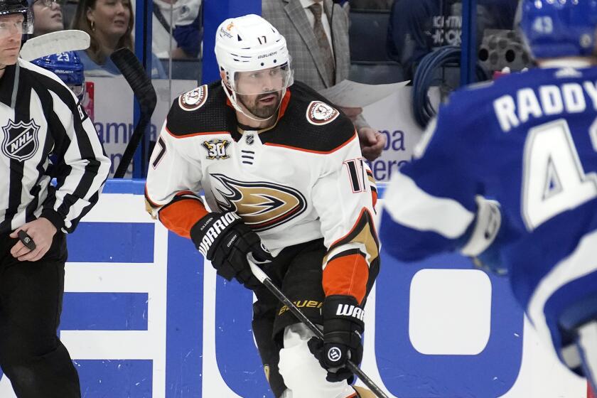 Ducks left wing Alex Killorn takes a pass in front of Tampa Bay Lightning defenseman Darren Raddysh.