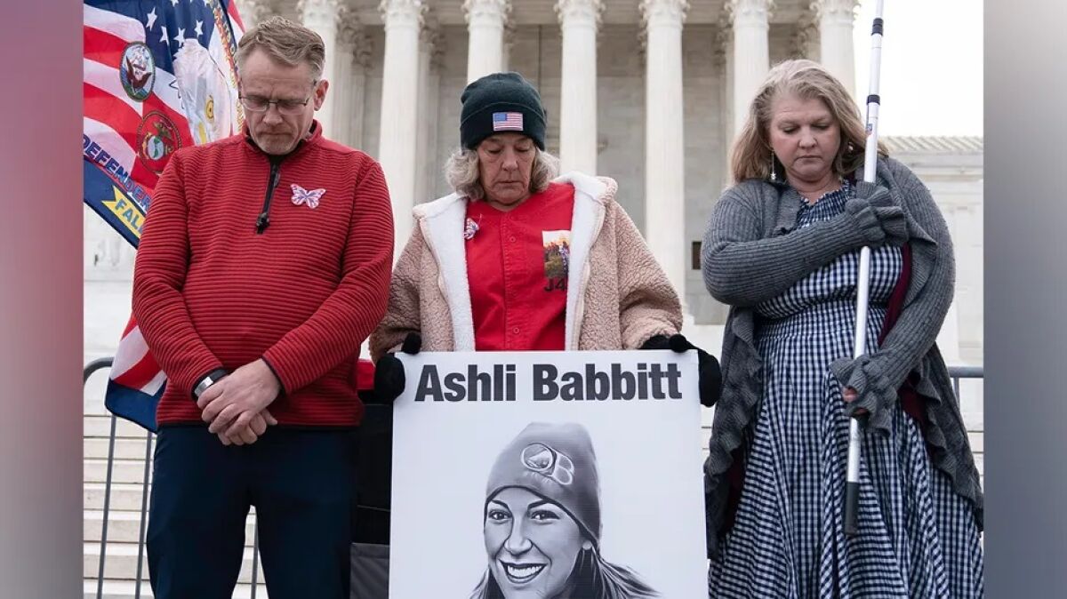 Micki Witthoeft (center), mother of Ashli Babbitt, joins protesters outside the U.S. Supreme Court on Jan. 6.