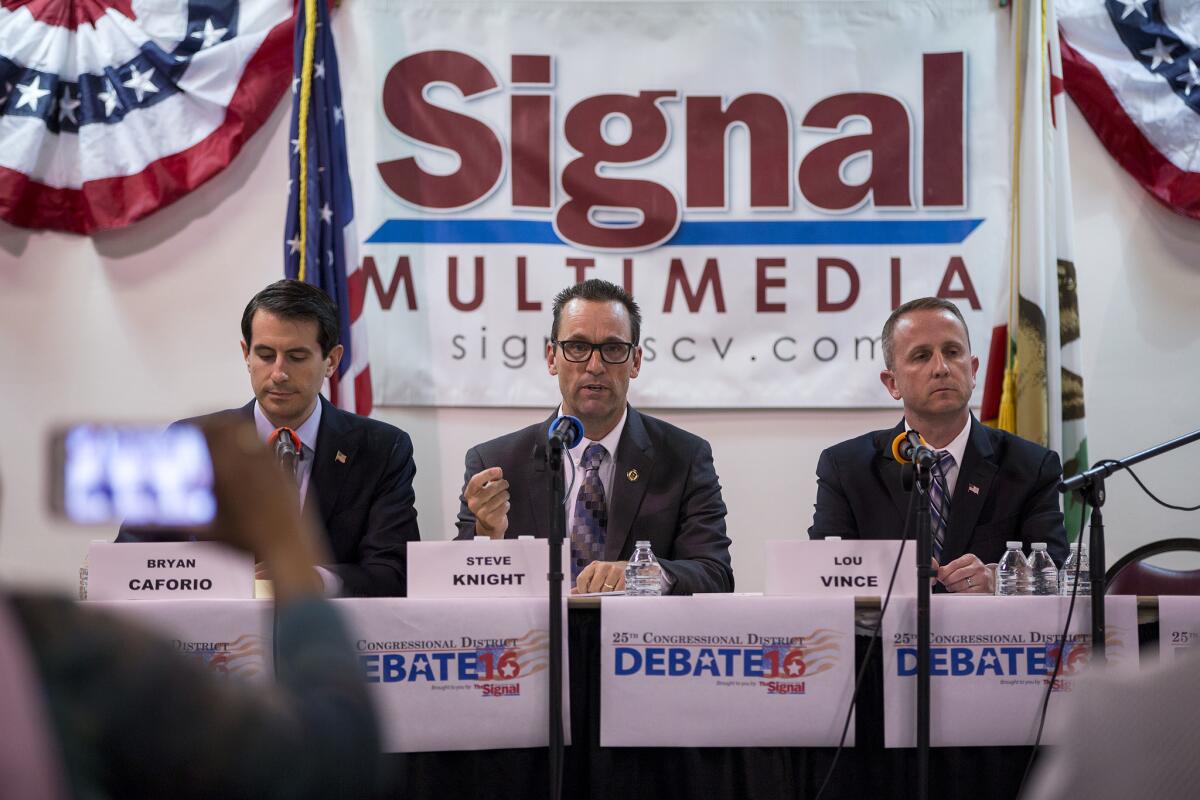 Bryan Caforio, left, Rep. Steve Knight and LAPD Lt. Lou Vince debate in Newhall on May 5. The three running in the 25th Congressional District. (Gina Ferazzi / Los Angeles Times)