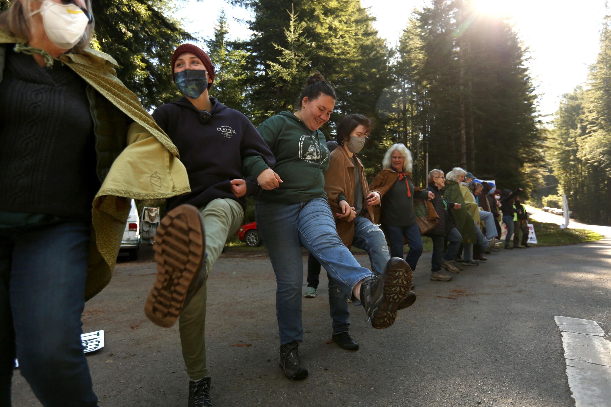 "Forest defenders" dance and celebrate their efforts to bring a temporary stop to timber sales.