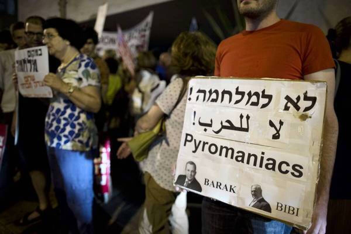 Israelis protest in Tel Aviv against a threatened Israeli military strike on Iran.