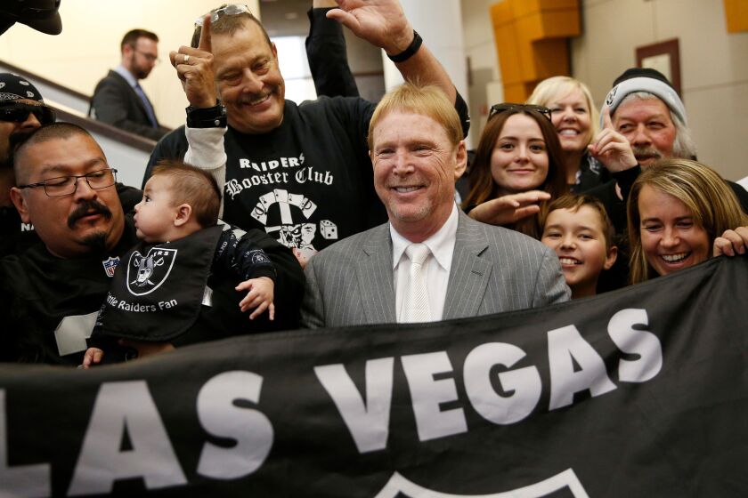 Raiders owner Mark Davis, center, meets with Raiders fans in Las Vegas on April 28.