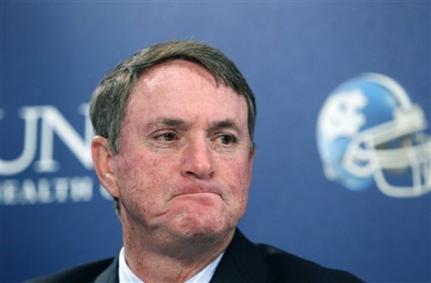 North Carolina head football coach Butch Davis listens during a news conference with UNC chancellor Holden Thorp and athletics director Dick Baddour where they talked about an investigation into their NCAA college football program on Thursday, Aug. 26, 2010, at the Kenan Field House in Chapel Hill, N.C. The investigation of North Carolina's football program has expanded into possible academic misconduct involving players and a woman who has also worked as a tutor for coach Davis' son. (AP Photo/The News & Observer, Ethan Hyman)