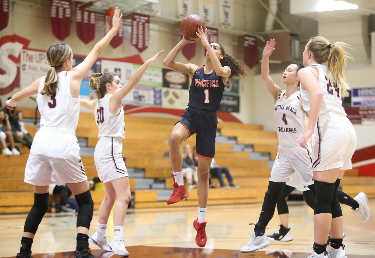 Pacifica Christian Orange County's Charis Wondercheck takes a running jumper while surrounded by Laguna Beach defenders in a nonleague game on Friday.