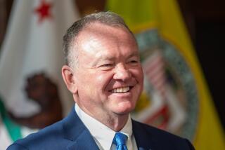 Los Angeles, CA - October 04: Jim McDonnell (R) speaks after being introduced by Mayor Karen Bass to serve as the new Chief LAPD during a press conference at City Hall Friday, Oct. 4, 2024 in Los Angeles, CA. (Ringo Chiu / For The Times)