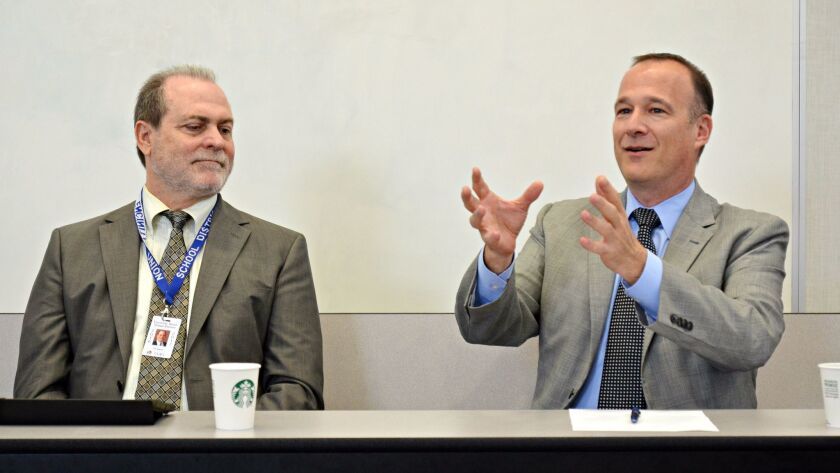 Eric Dill, right, superintendent at San Dieguito Union High School District, discusses achievements at the district alongside Encinitas Union School District Superintendent Timothy Baird at a forum at Pacific Trails Middle School on March 15.