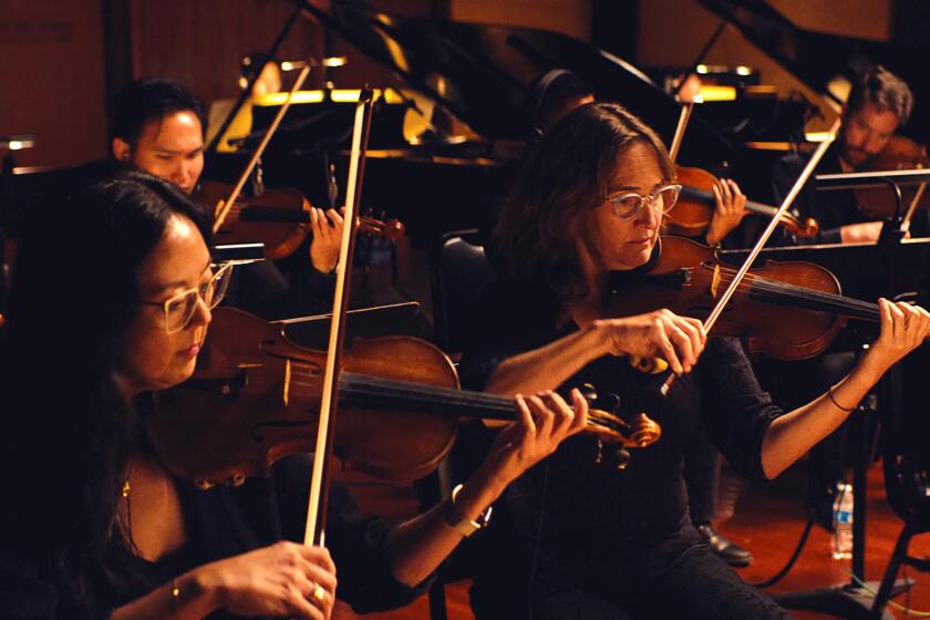 BURBANK, CALIFORNIA-Musicians, who are alumni of Los Angeles public schools, performing "The Alumni" at the Eastwood Scoring Stage in Burbank. (Courtesy of Breakwater Studios)