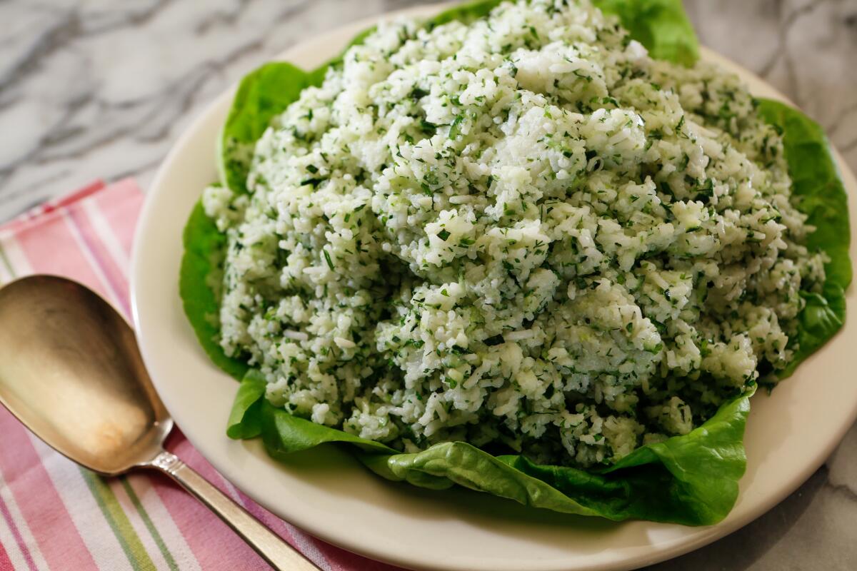 A bowl of rice and cucumber salad