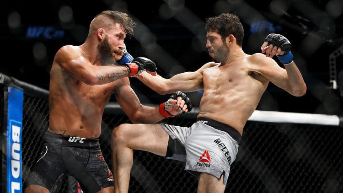 Jeremy Stephens, left, and Gilbert Melendez trade blows during their fight at UFC 215.To see more images from the card, click on the photo above.