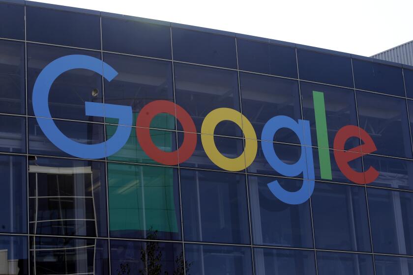 FILE - In this Sept. 24, 2019, file photo a sign is shown on a Google building at their campus in Mountain View, Calif. Google plans offer checking accounts run by Citigroup and a credit union, according to a report by The Wall Street Journal. (AP Photo/Jeff Chiu, File)