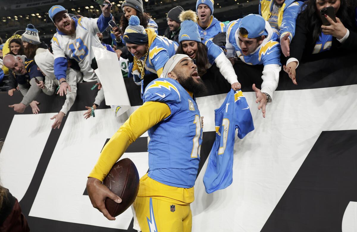 Chargers wide receiver Keenan Allen celebrates with fans after Monday night's game.