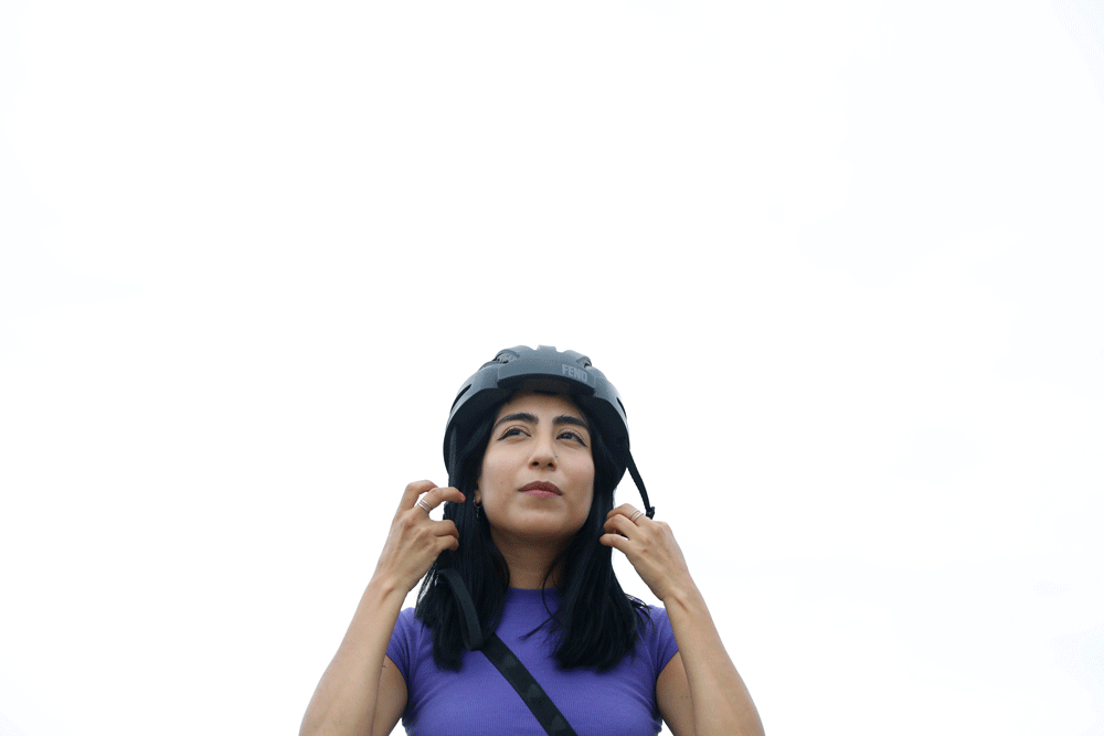 A GIF of Michelle Morrow on a bike helmet.